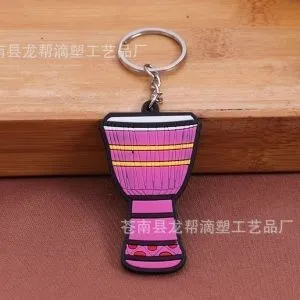 Брелок резиновый Африканский барабан. Цвет розовый.